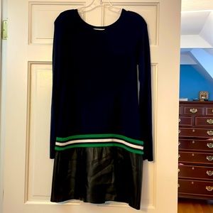 This is a barely worn navy dress, with leather on the bottom.